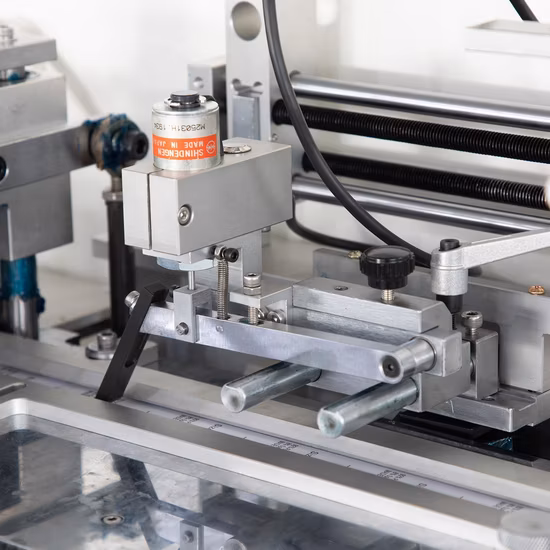 China Woven Label Cut and Fold Machine / Garment Fabric Wash Care Label Cutting and Folding Machine for Polyester Satin Ribbon Cotton Tape Nylon Taffeta Jz-2817